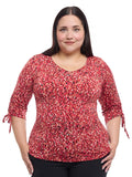 Blusa estampada con mangas y jaretas